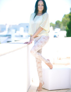 Gorgeous milf brunette heartbreaker Melanie on the balcony in white lace pantyhose